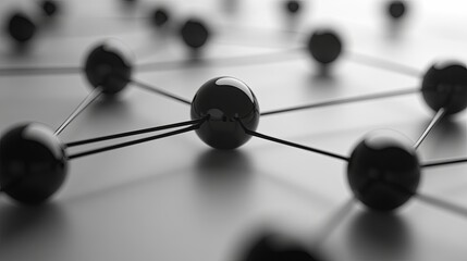 Visual representation of interconnected black spheres,  network planning through nodes and lines that depict relationships and data flow.