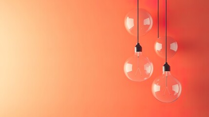 Light Bulbs Hanging on a Gradient Orange Background