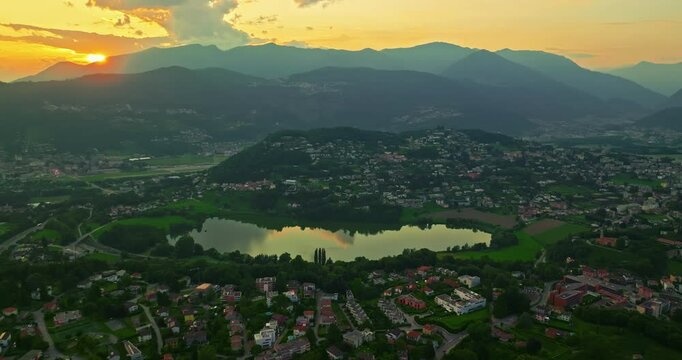 Aerial view of Lugano city and lugano lake from San Salvatore mountain. Aerial footage of the Monte Bre overlooking the city of Lugano in Canton Ticino in Switzerland