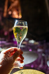 Celebration, night club with party lights and glass of champagne sparkling wine, dancing with wine, wedding event