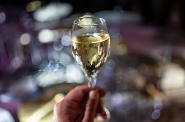 Celebration, night club with party lights and glass of champagne sparkling wine, dancing with wine, wedding event