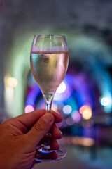 Celebration, night club with party lights and glass of champagne sparkling wine, dancing with wine, wedding event