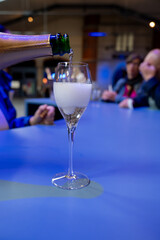 Tasting of brut and reserve grand cru champagne sparkling wine produced by traditional method in underground caves in Champagne, France, close up