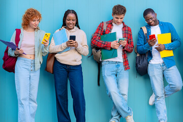 Fototapeta premium Four students having fun with mobile phones creating content on social media.