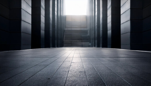 An empty room with smooth concrete walls and floor, creating a minimalist and abstract architectural background. The dark tones give a sense of industrial simplicity and modern design