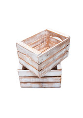 Small wooden box crate used for fruit or vegetables stand on top of each other. Isolated on a white background