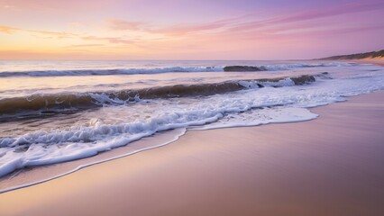 Obraz premium A serene coastal scene at dawn, with the tranquil ocean meeting the golden sand, as soft pink and purple hues in the sky melt into warm golden tones.