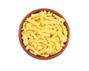 Crunchy cheese and corn snacks in a earthenware bowl on white background. Top view.