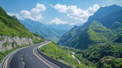 Fototapeta premium Scenic Curved Road Through Lush Green Mountains