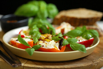 Mini peppers stuffed with cream cheese in olive oil with basil