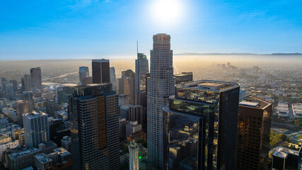 Varied architecture in the downtown of Los Angeles, California, United States. Vast cityscape is dazzled with bright sunlight. Top view.