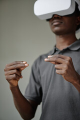 Low angle shot of African American male hands gesticulating in air during VR game © AnnaStills