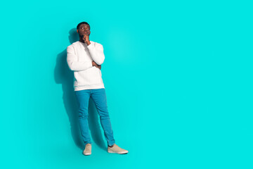 Full size photo of pretty young male skeptical minded look empty space wear trendy white outfit...