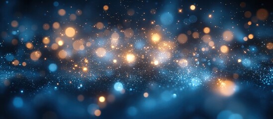 Obraz premium Abstract blue and gold bokeh background with sparkling lights.