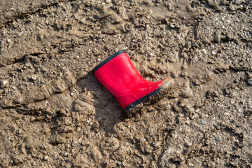 red boot in mud