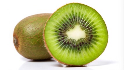 Fototapeta premium A whole kiwi fruit and a half of a kiwi fruit, cut in half, revealing the green flesh and black seeds.