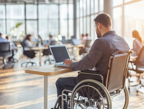 Wheelchair User in Modern Open Space Office, Inclusive Environment with Colleagues