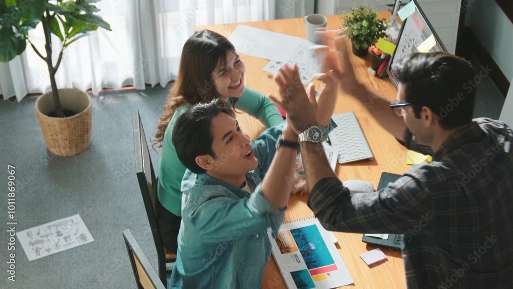 Poster top view of professional business team hands looking at color palette at table while giving high fiv