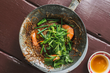 Thai baked shrimp with glass noodles or Goong Ob woonsen served in the pot.