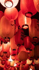 Red and white paper lanterns with Japanese letters and signs © Javier