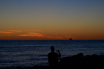 Fototapeta premium Sunset and sea view on the shore of the city of Bar, Montenegro