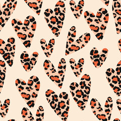 Vector seamless pattern with animal print. Leopard print. Hearts with a leopard print in the middle in warm shades.