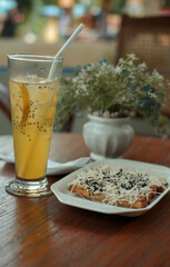 iced orange drink in a glass on the table