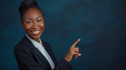 Confident Black Businesswoman Smiling and Pointing in a Studio Setting