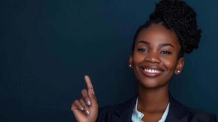 Confident Black Businesswoman Pointing Upwards With a Smile