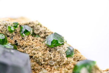 Demantoid, green andradite garnet. Specimen from Takab, West Azerbaijan Province, Iran. macro photography detail texture background. close-up mineral crystal unpolished semi-precious gemstone
