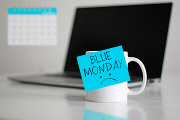 Blue Monday text with sad face on the cup. Blue Monday concept