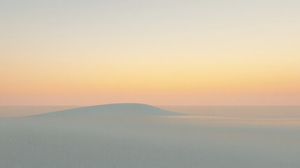 Fototapeta premium Soft hues merge with mist as distant hills emerge at dawn inviting tranquility and reflection