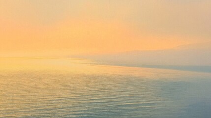 Gentle waves reflect the soft hues of a pastel sky just before nightfall