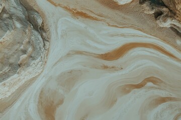 Obraz premium A drone shot of a couple walking through a desert landscape