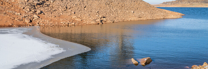 winter panorama of Horsetooth Reservoir at foothills of Rocky Mountains in northern Colorado