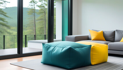 teal fabric pouf sits near grey sofa teal yellow pillows black window forest view