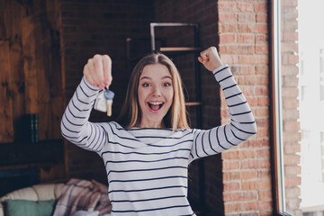 Photo of attractive teen female winning hold key real estate dressed striped outfit cozy day light...