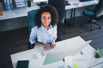 Photo of positive good mood lady specialist dressed shirt texting modern device indoors workstation...
