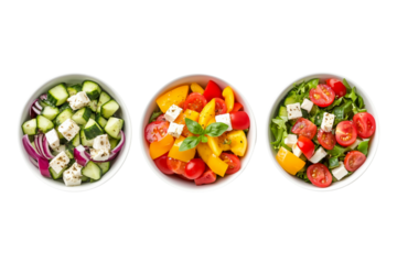 Glass jars filled with fresh vegetable salad featuring tomatoes, cucumbers, olives, onions, and feta cheese isolated on a white background, symbolizing healthy eating