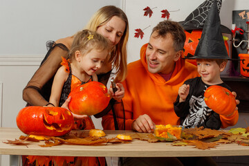 Family bonding time, carving pumpkins for a fun Halloween night