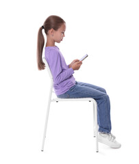 Girl with correct posture and smartphone sitting on white background