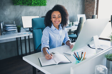 Photo of positive good mood lady specialist dressed shirt writing book typing modern device indoors...