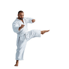 Man performing a high kick in martial arts uniform on transparent background