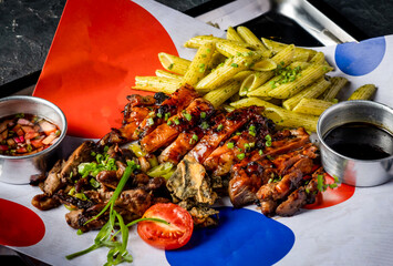 Filipino Grilled Boneless Chicken with Penne Pasta, grilled vegetables and Sauces served dish in tray isolated on grey background closeup side view of platter meal