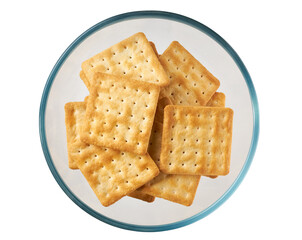 Square water crackers in a clear glass bowl isolated on white background, top view.