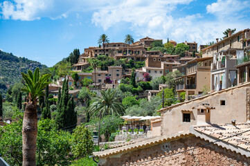 Cityscape of Deia, mallorca with buildings on a hill cityscape during great weather, majorca
