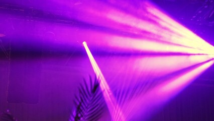 High Luminance Stage Disco Lights Casting Colorful Light Beams during Concert Gig Performance in...