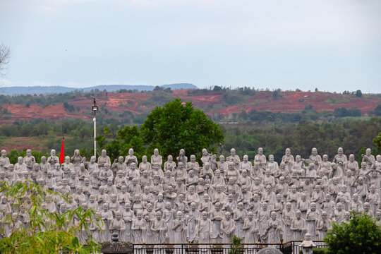 Large group of statues of monks or religious figures arranged in rows in buddhist temple Patung Seribu (Vihara Ksitigarbha Bodhisattva, 500 Lohan Temple) on Bintan Island, Indonesia. Tanjung Pinang