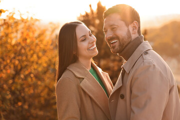 Fototapeta premium Beautiful couple spending time together in autumn park