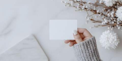 Obraz premium Hand Holding a White Credit Card | Secure Payment and Financial Transactions with Modern Card Technology